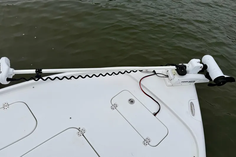 Slide: The Image of 2022 Sea Hunt BX 22 BR boat with Minn Kota trolling motor on calm water. - 41