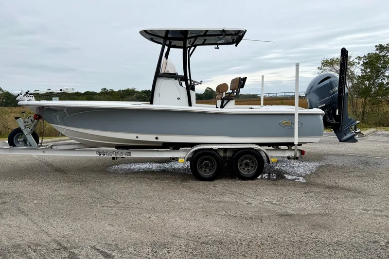 Slide: The Image of 2022 Sea Hunt BX 22 BR boat on trailer, side view, outdoors. - 47