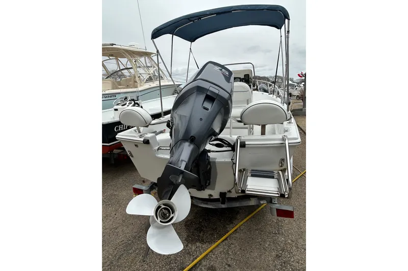 Slide: The Image of 2007 Triumph 170 CC boat console with steering wheel and gauges. - 6