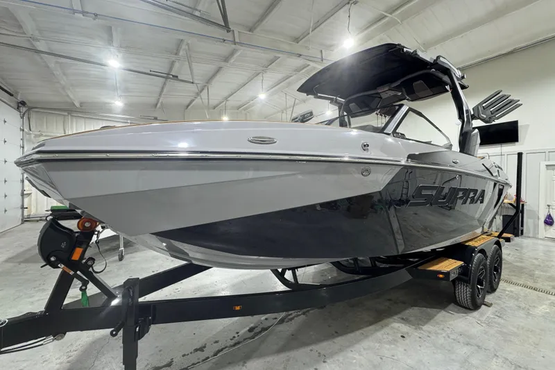 Slide: The Image of 2026 Supra SA boat in a showroom, showcasing sleek design and modern features. - 10