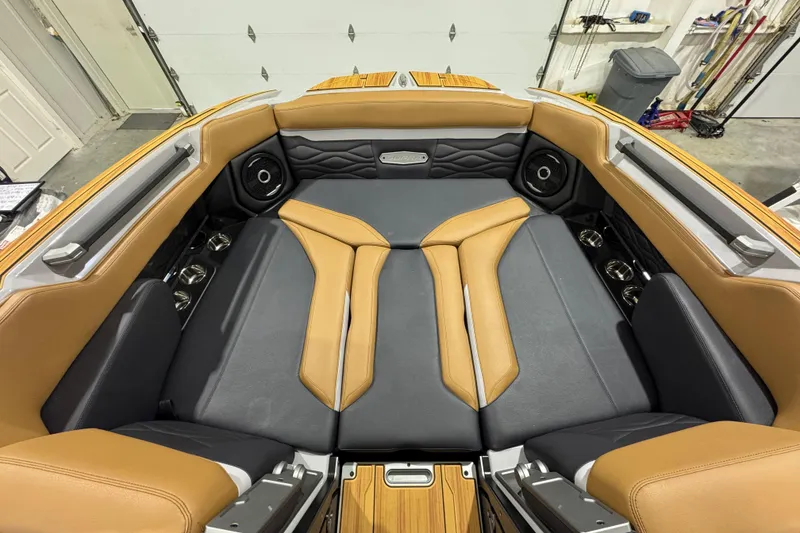 Slide: The Image of 2026 Supra SA boat interior with tan and gray seating, premium speakers, and sleek design. - 17
