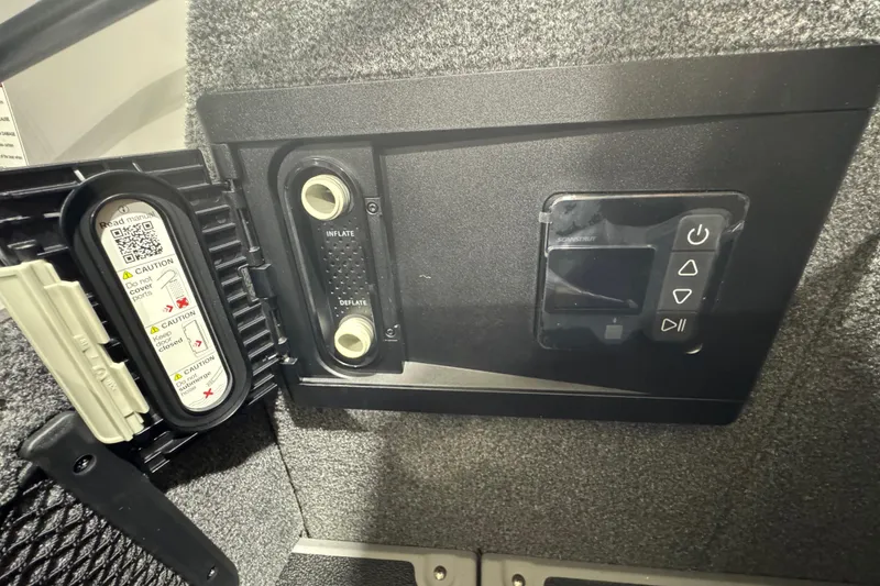 Slide: The Image of Control panel of 2026 Supra SA with inflate and deflate options, caution labels visible. - 24