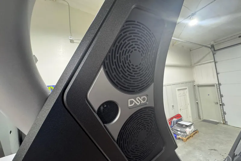 Slide: The Image of 2026 Supra SA speaker system in a modern garage setting. - 25