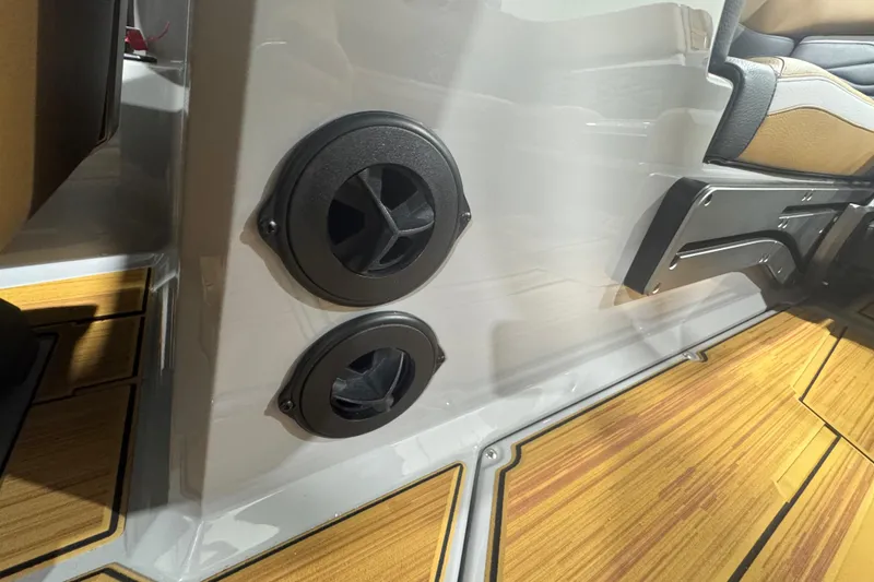 Slide: The Image of 2026 Supra SA interior with wood flooring and black speaker vents. - 29