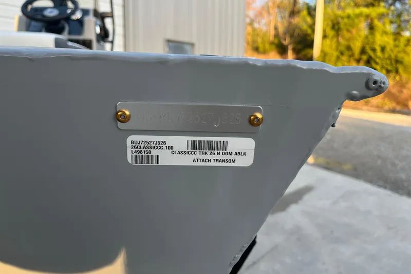Slide: The Image of 2026 Tracker Bass Tracker Classic CC transom with identification plate and label. - 57