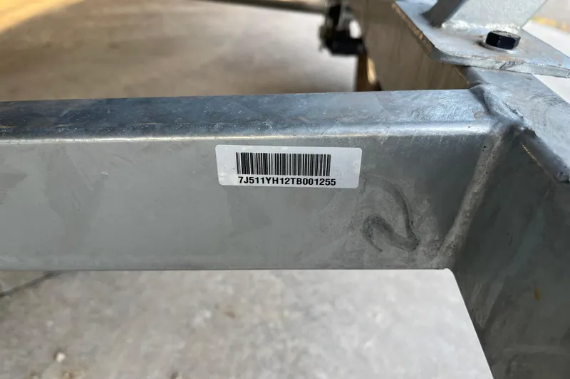 Slide: The Image of Barcode on metal frame of 2026 Tracker Bass Tracker Classic CC boat trailer. - 59