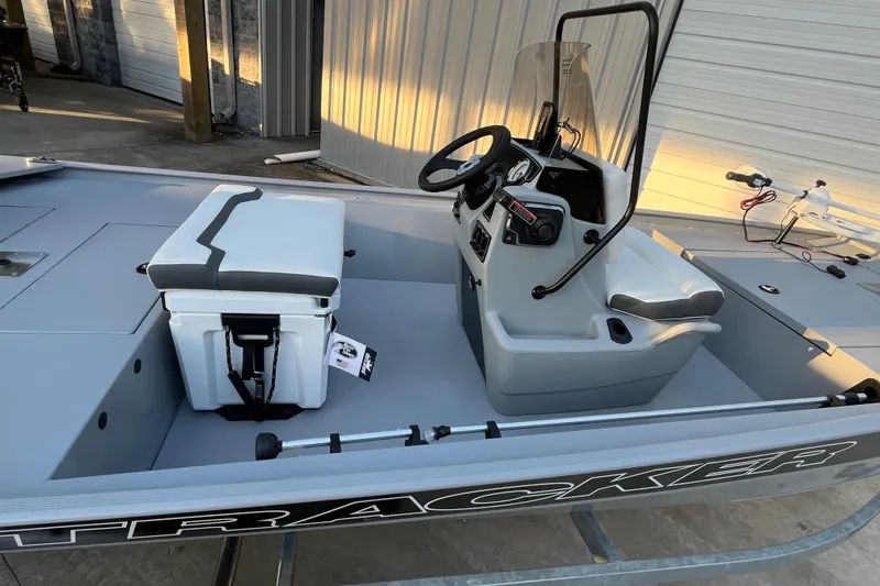 Slide: The Image of 2026 Tracker Bass Tracker Classic CC boat interior with console and seating. - 61