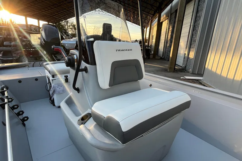 Slide: The Image of 2026 Tracker Bass Tracker Classic CC boat interior with steering console and seating. - 65