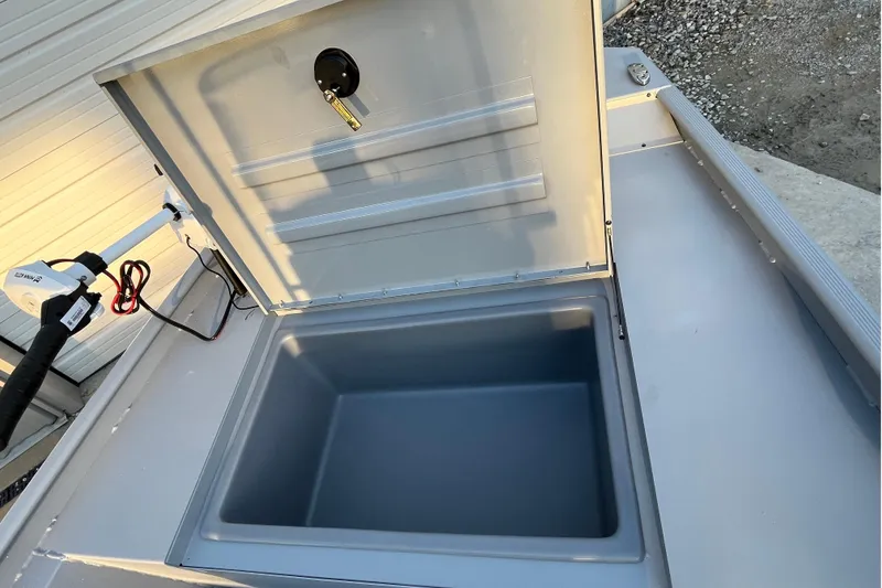 Slide: The Image of Open storage compartment on 2026 Tracker Bass Tracker Classic CC boat. - 66