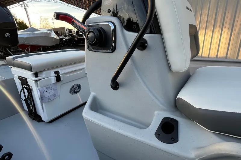 Slide: The Image of 2026 Tracker Bass Tracker Classic CC boat interior with seating and control panel. - 69