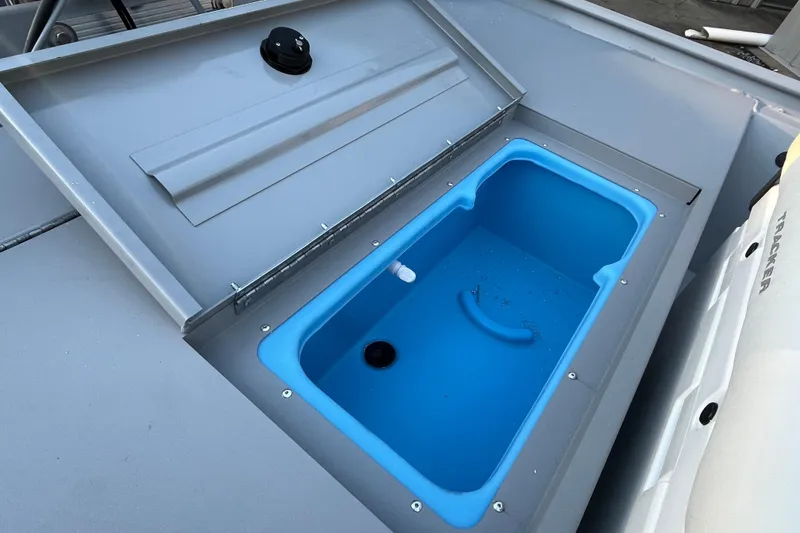 Slide: The Image of Open storage compartment on 2026 Tracker Bass Tracker Classic CC boat. - 71