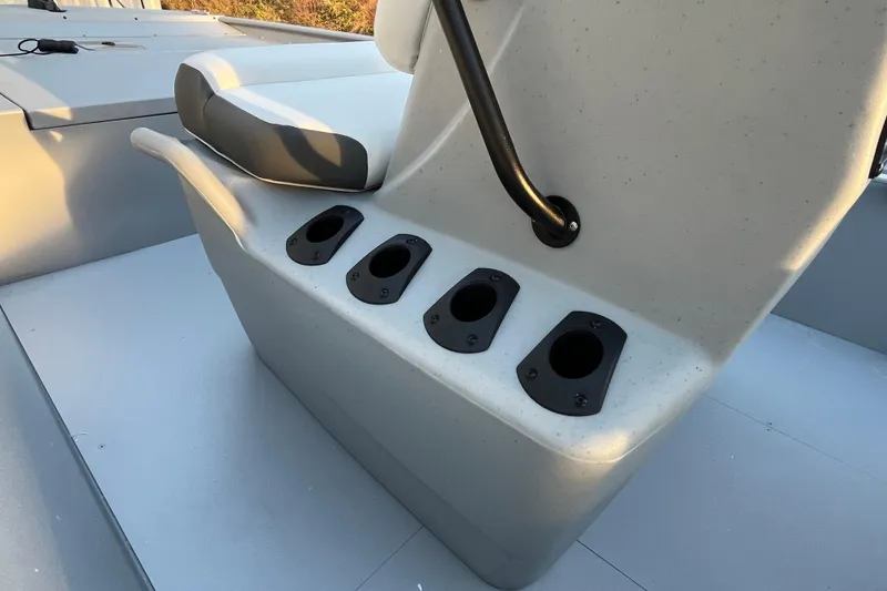 Slide: The Image of 2026 Tracker Bass Tracker Classic CC boat seat with rod holders and grab handle. - 72