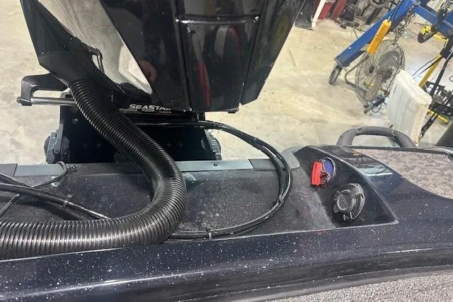 Slide: The Image of 2026 Nitro Z21 XL Pro boat engine and control panel in a workshop setting. - 114