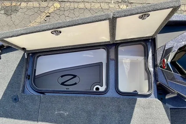 Slide: The Image of 2026 Ranger Z518 boat storage compartments open, showcasing interior design and functionality. - 16