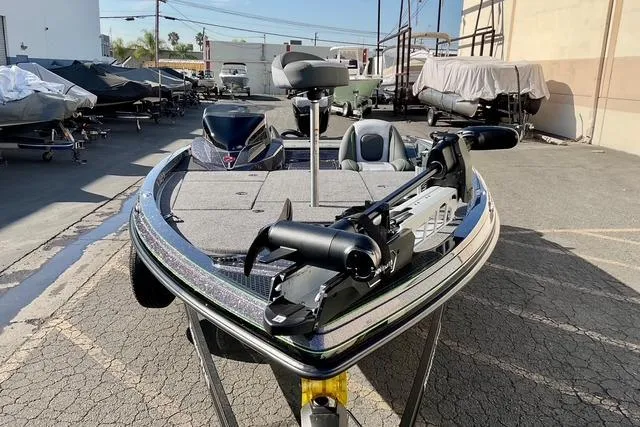 Slide: The Image of 2026 Ranger Z518 boat in a parking lot, featuring advanced fishing equipment. - 23