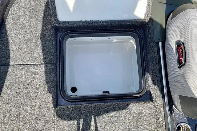 Slide: The Image of 2026 Ranger Z518 boat storage compartment with open lid, showcasing interior space. - 27