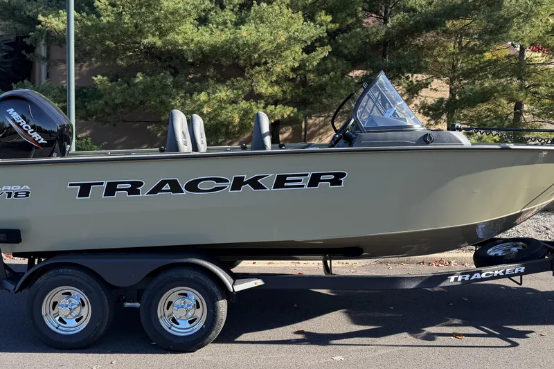 Slide: The Image of 2026 Tracker Targa V-19 Combo boat dashboard with steering wheel and gauges. - 2
