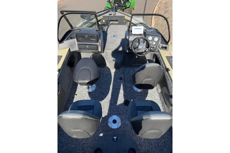 Slide: The Image of 2026 Tracker Targa V-19 Combo boat interior with four seats and steering console. - 4