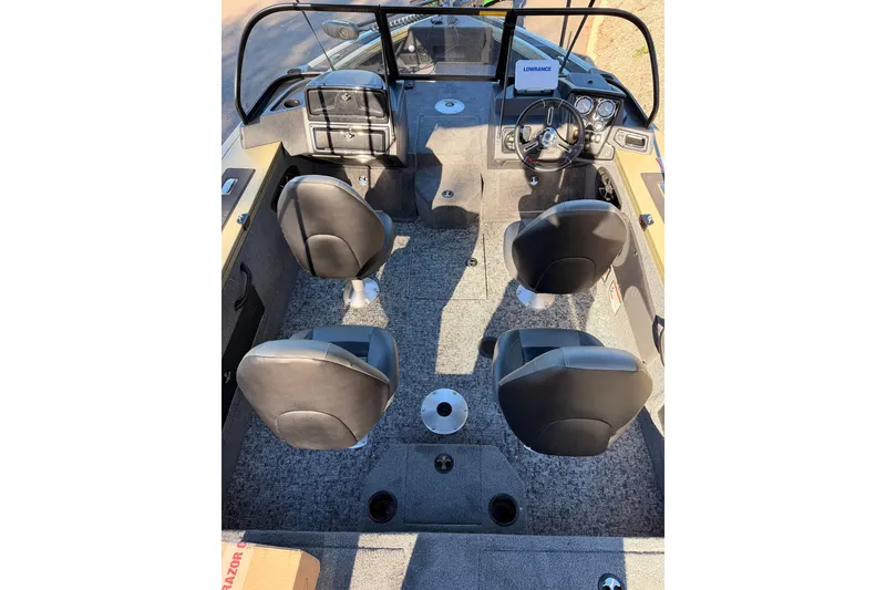 Slide: The Image of Interior of 2026 Tracker Targa V-19 Combo boat with four seats and dashboard. - 6