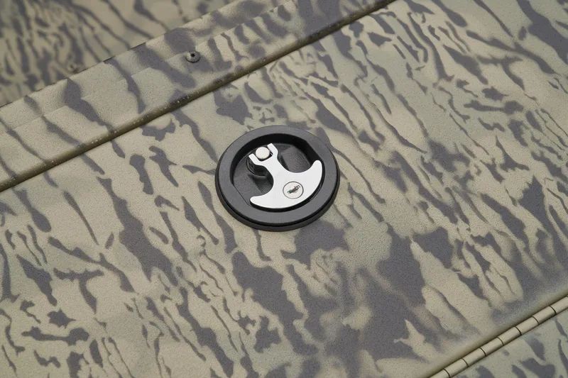 Slide: The Image of Livewell compartment of 2026 Tracker Grizzly 1860 CC boat, featuring rod holders and drainage. - 15