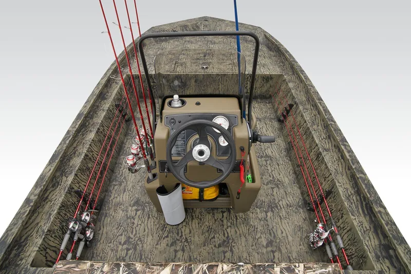 Slide: The Image of 2026 Tracker Grizzly 1860 CC boat console with steering wheel and gauges. - 20