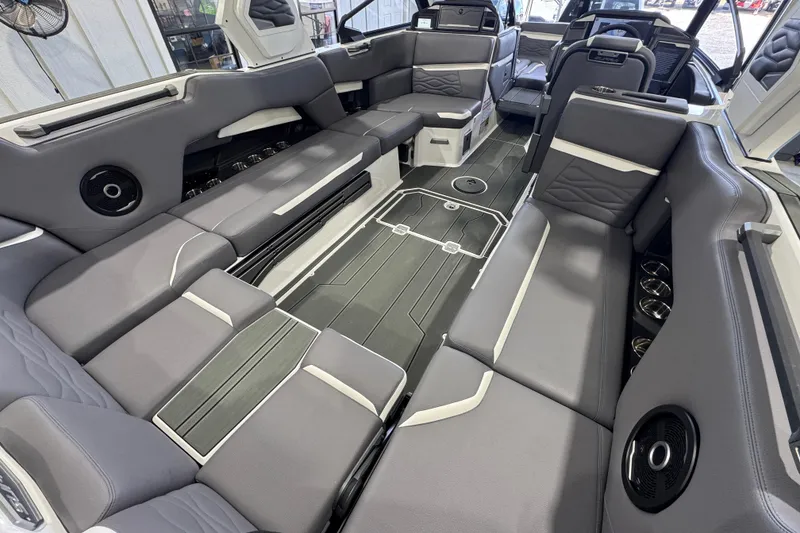 Slide: The Image of 2026 Supra SE boat interior with luxurious gray seating and modern design features. - 10