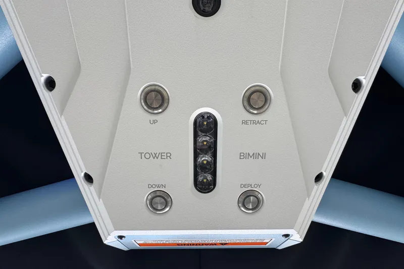 Slide: The Image of Control panel of 2026 Supra SE boat with tower and bimini buttons. - 16