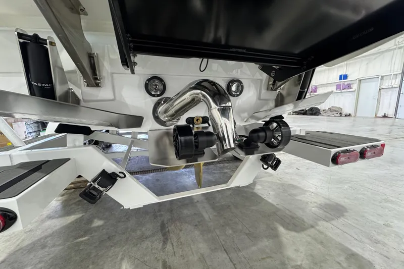 Slide: The Image of 2026 Supra SE boat's rear view showcasing advanced propulsion system in a garage setting. - 6