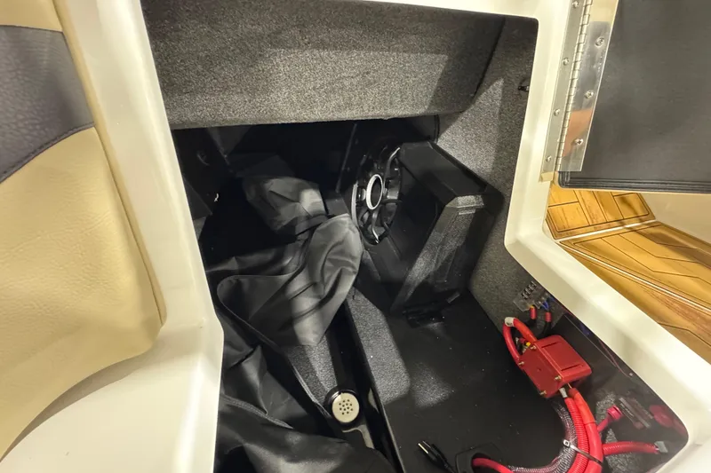 Slide: The Image of 2026 Moomba Mojo boat interior storage compartment with speaker and wiring. - 14