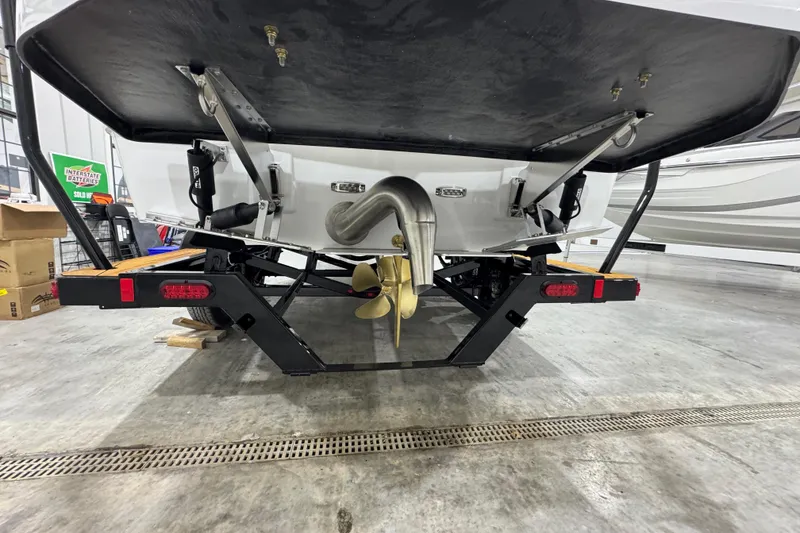 Slide: The Image of Rear view of 2026 Moomba Mojo boat on trailer in a garage setting. - 4