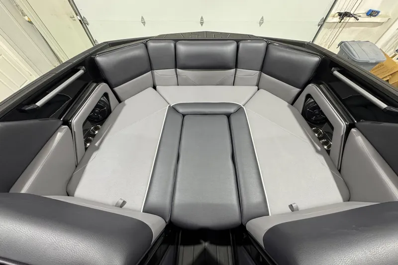 Slide: The Image of 2026 Moomba Max boat interior with sleek gray and black seating design. - 14