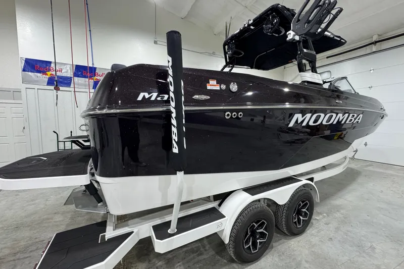 Slide: The Image of 2026 Moomba Max boat on trailer in indoor showroom setting. - 5
