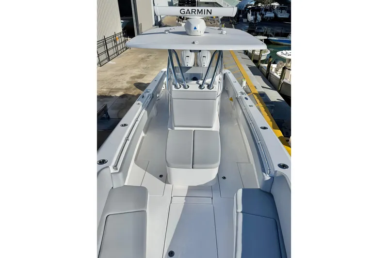 Slide: The Image of 2026 Contender 35 ST boat with Garmin equipment, docked at a marina. - 13