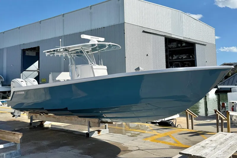 Slide: The Image of 2026 Contender 35 ST boat on display at a marina, with a modern design. - 3