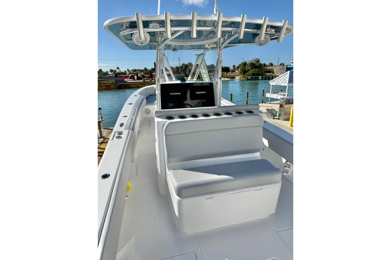 Slide: The Image of 2026 Contender 35 ST boat interior with seating and Garmin navigation system. - 9