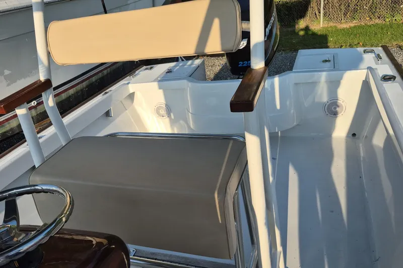 Slide: The Image of 1977 Wellcraft 270 Coastal O/B boat interior with seating and steering wheel. - 14