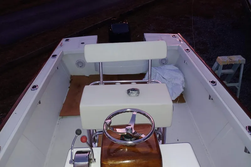 Slide: The Image of 1977 Wellcraft 270 Coastal O/B boat interior with steering wheel and seating. - 20