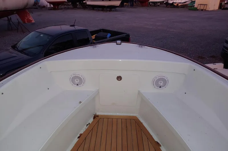 Slide: The Image of 1977 Wellcraft 270 Coastal O/B boat interior with speakers and wooden deck. - 22