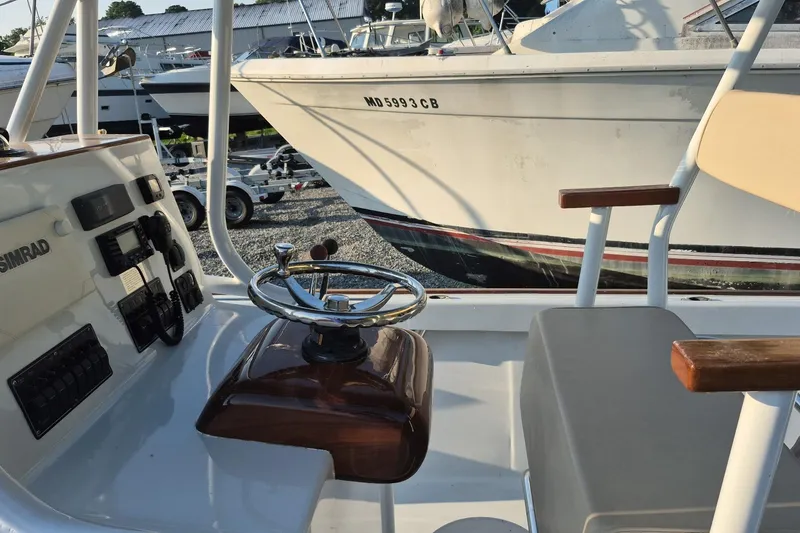 Slide: The Image of 1977 Wellcraft 270 Coastal O/B boat interior with steering wheel and control panel. - 4