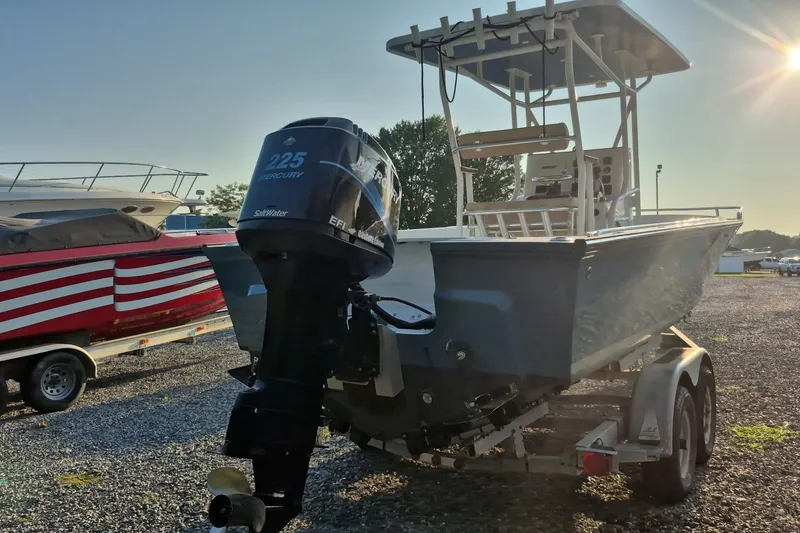 Slide: The Image of 1977 Wellcraft 270 Coastal O/B boat with Mercury 225 engine on trailer. - 6