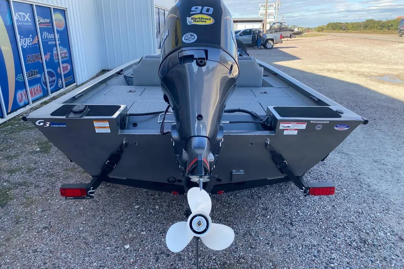 Slide: The Image of 2026 G3 Sportsman 1710 PFX boat with 90 HP outboard motor, rear view. - 5