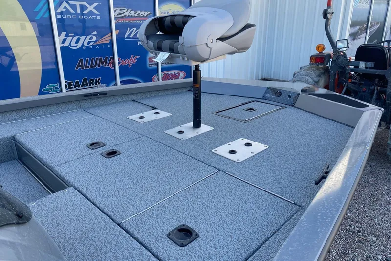 Slide: The Image of 2026 G3 Sportsman 1710 PFX boat deck with seating and storage compartments. - 9