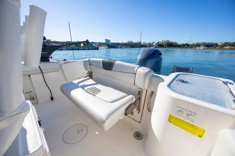 Slide: The Image of 2019 Wellcraft 222 Fisherman boat interior with seating and water view. - 22