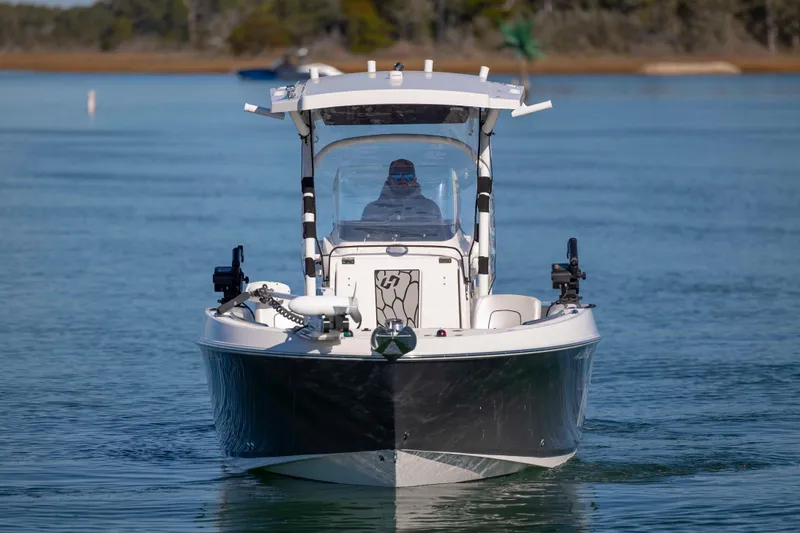 Slide: The Image of 2019 Wellcraft 222 Fisherman boat on calm water, front view. - 7