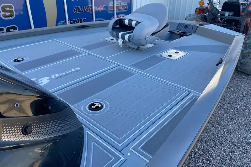 Slide: The Image of 2026 G3 Sportsman 1810 SE boat deck with seating and storage compartments. - 10