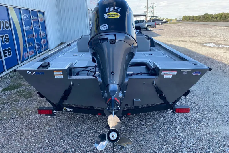 Slide: The Image of 2026 G3 Sportsman 1810 SE boat with powerful outboard motor, parked on gravel. - 5