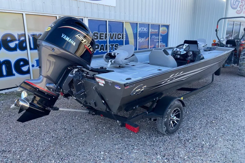 Slide: The Image of 2026 G3 Sportsman 1810 SE boat with Yamaha engine on trailer, parked outdoors. - 6