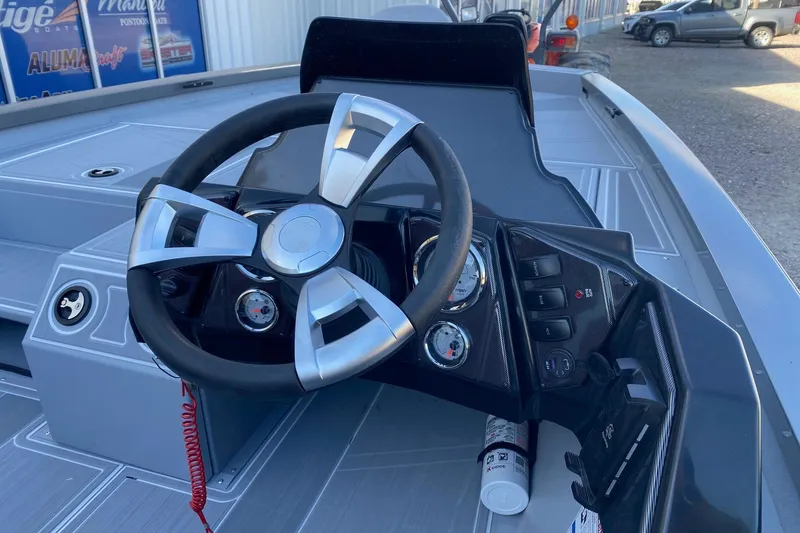 Slide: The Image of Steering console of 2026 G3 Sportsman 1810 SE boat, featuring modern controls and gauges. - 7