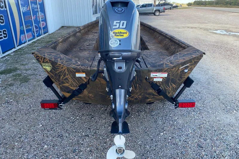 Slide: The Image of 2026 G3 Gator Tough 17 DK boat with camouflage design and 50 HP outboard motor. - 4