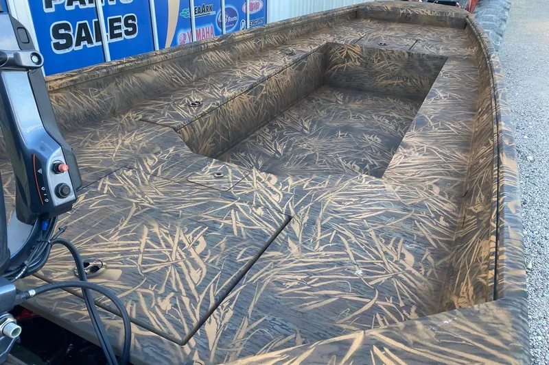 Slide: The Image of 2026 G3 Gator Tough 17 DK boat with camouflage interior design. - 6